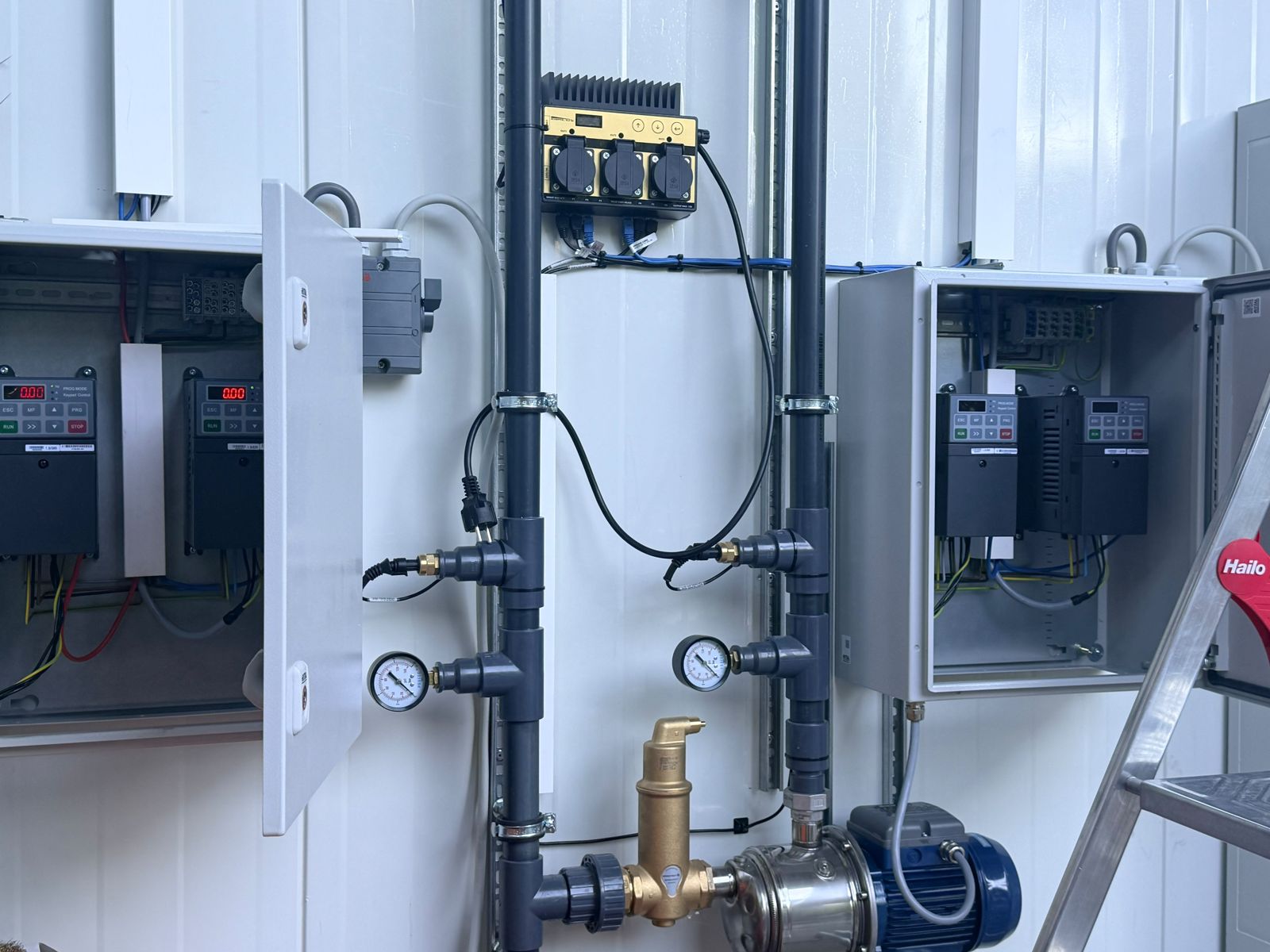Control boxes and sensors on a technical wall